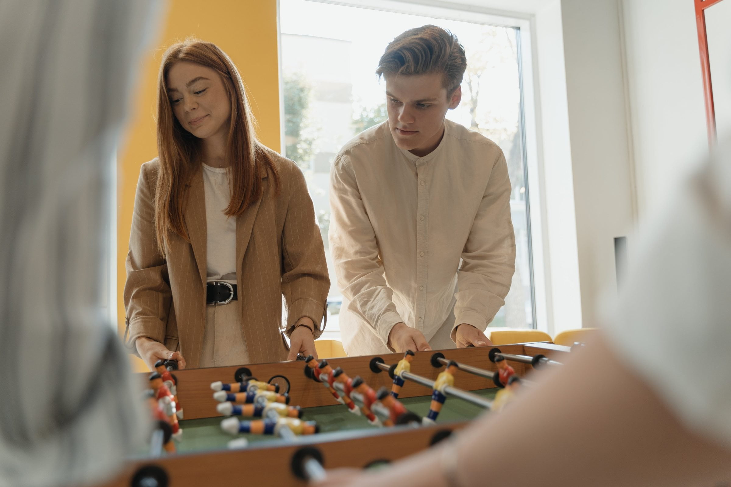 Kids playing foosball